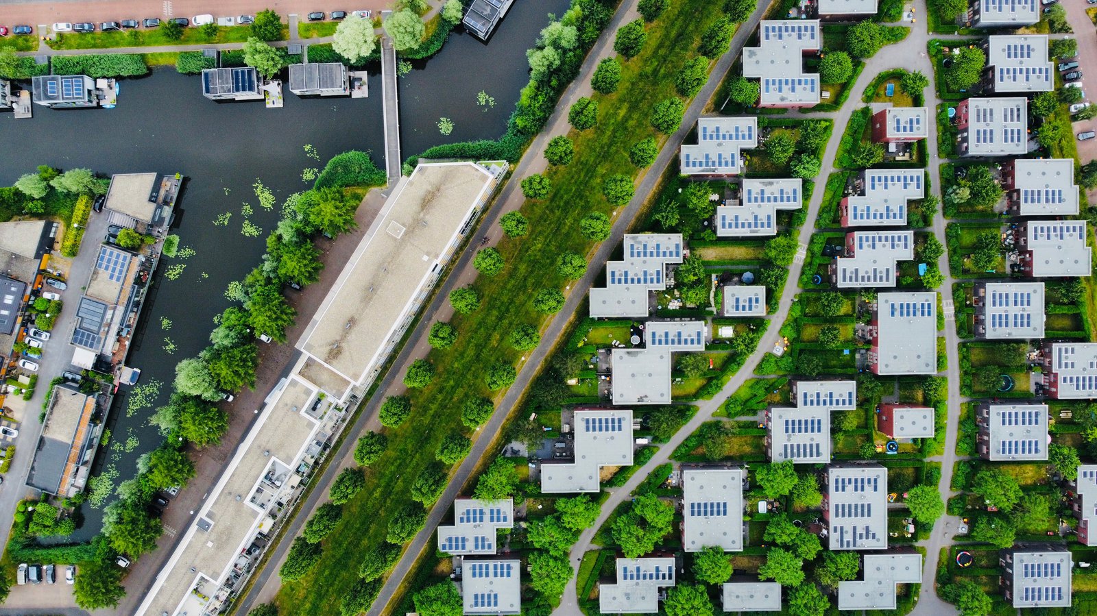 Aerial shot of housing development surrounded by greenery